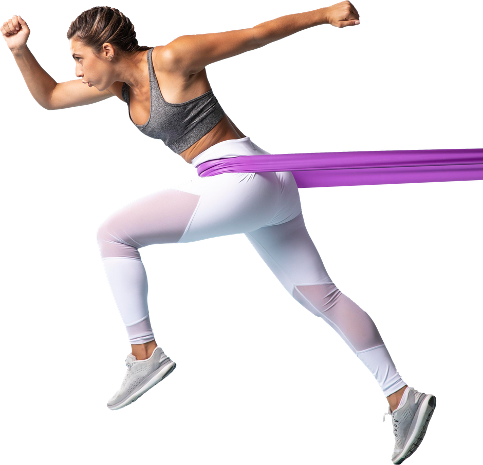 Woman running with resistance band, wearing white and gray workout clothes, outdoors.