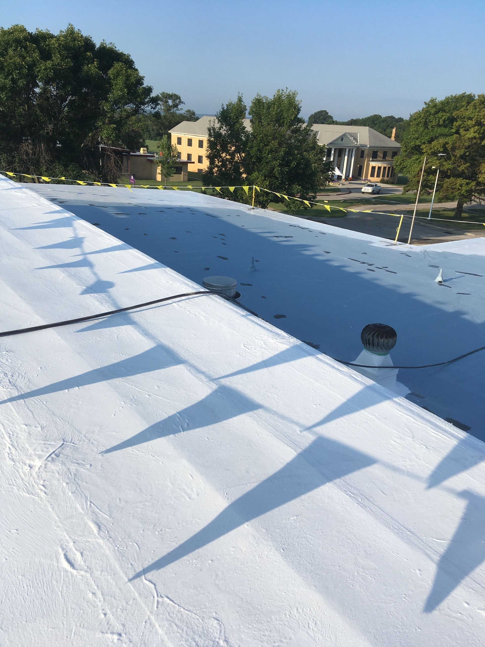 A white roof with a blue sky in the background