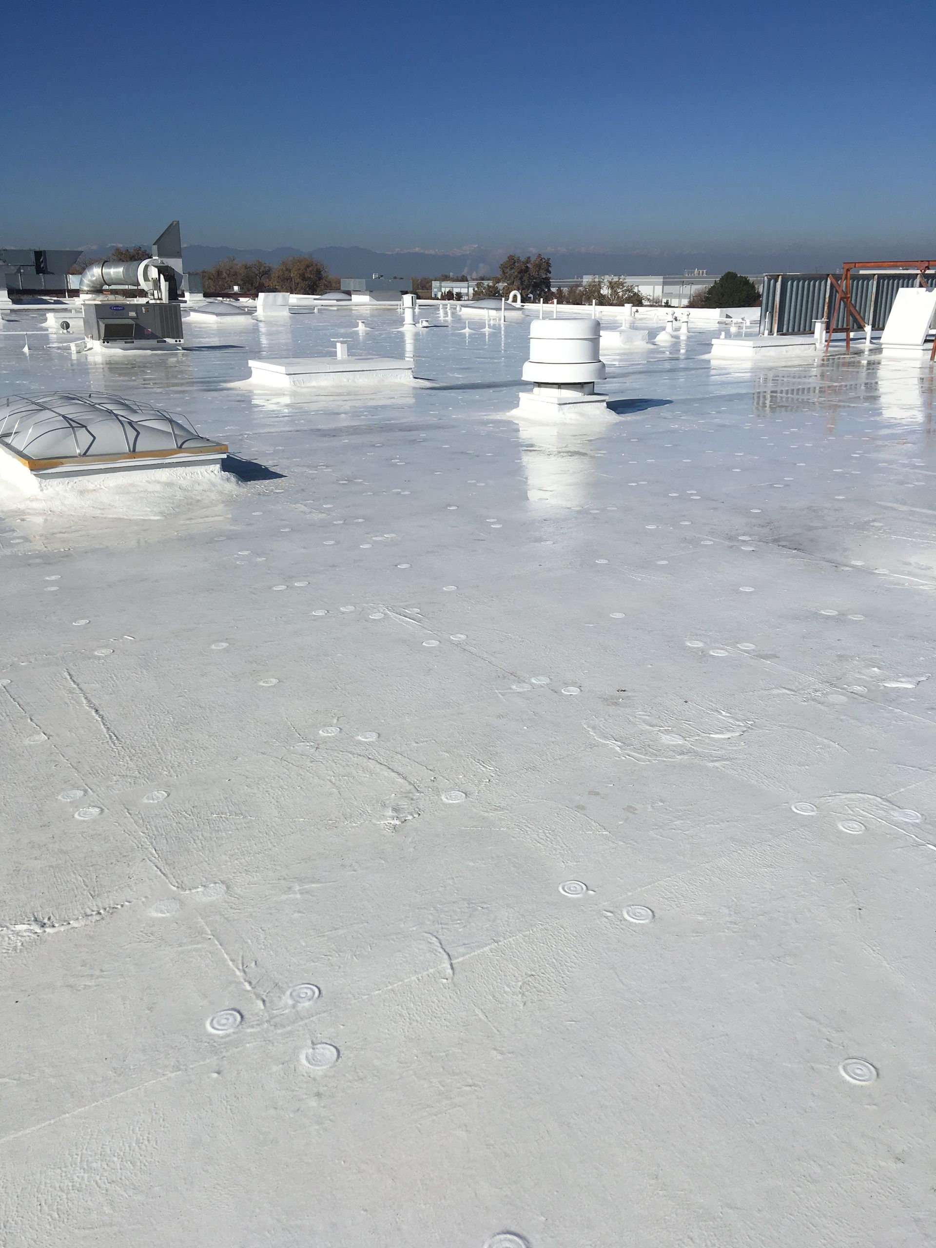 A white roof with a blue sky in the background