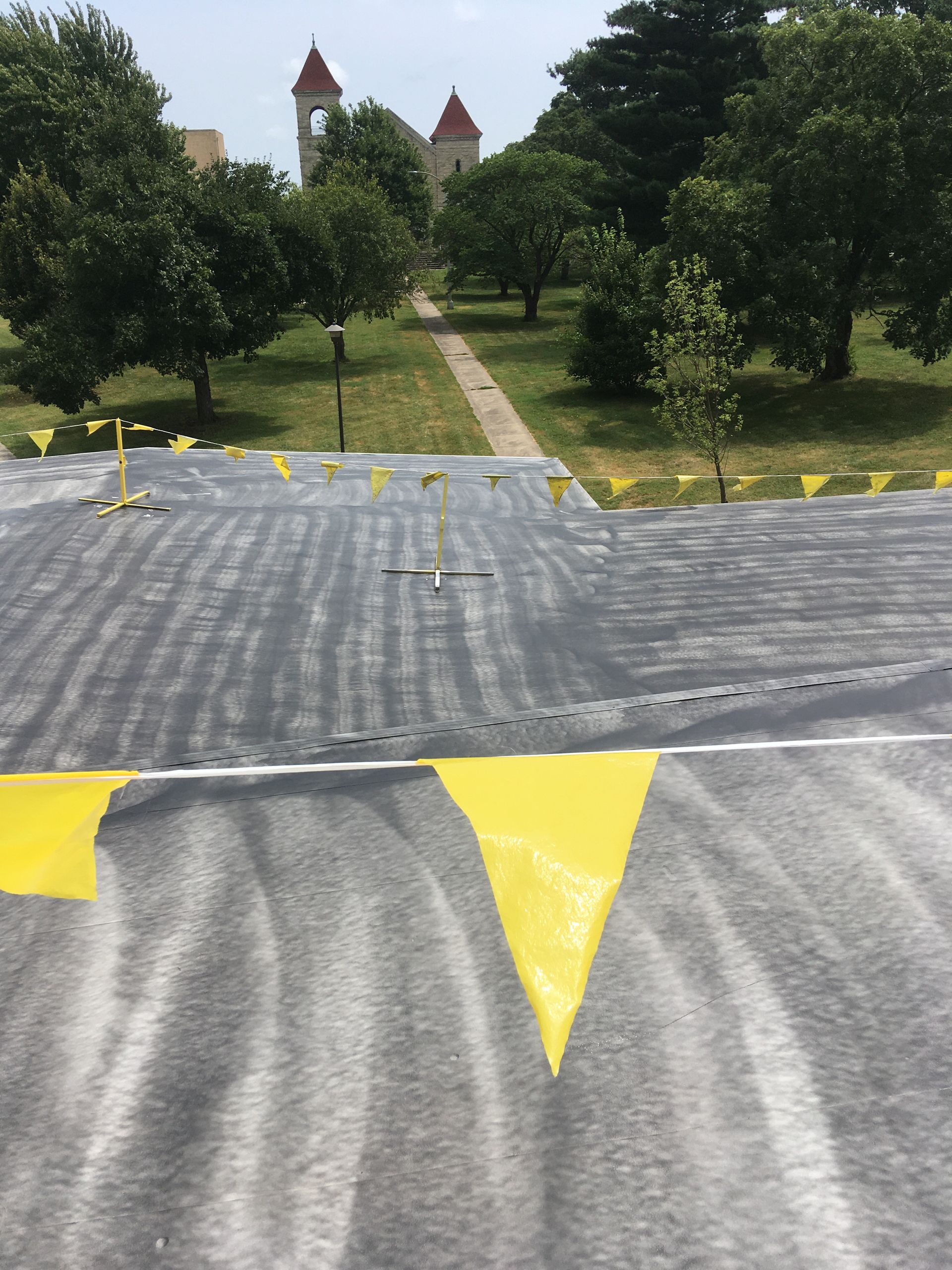 A black tarp with yellow triangles on it