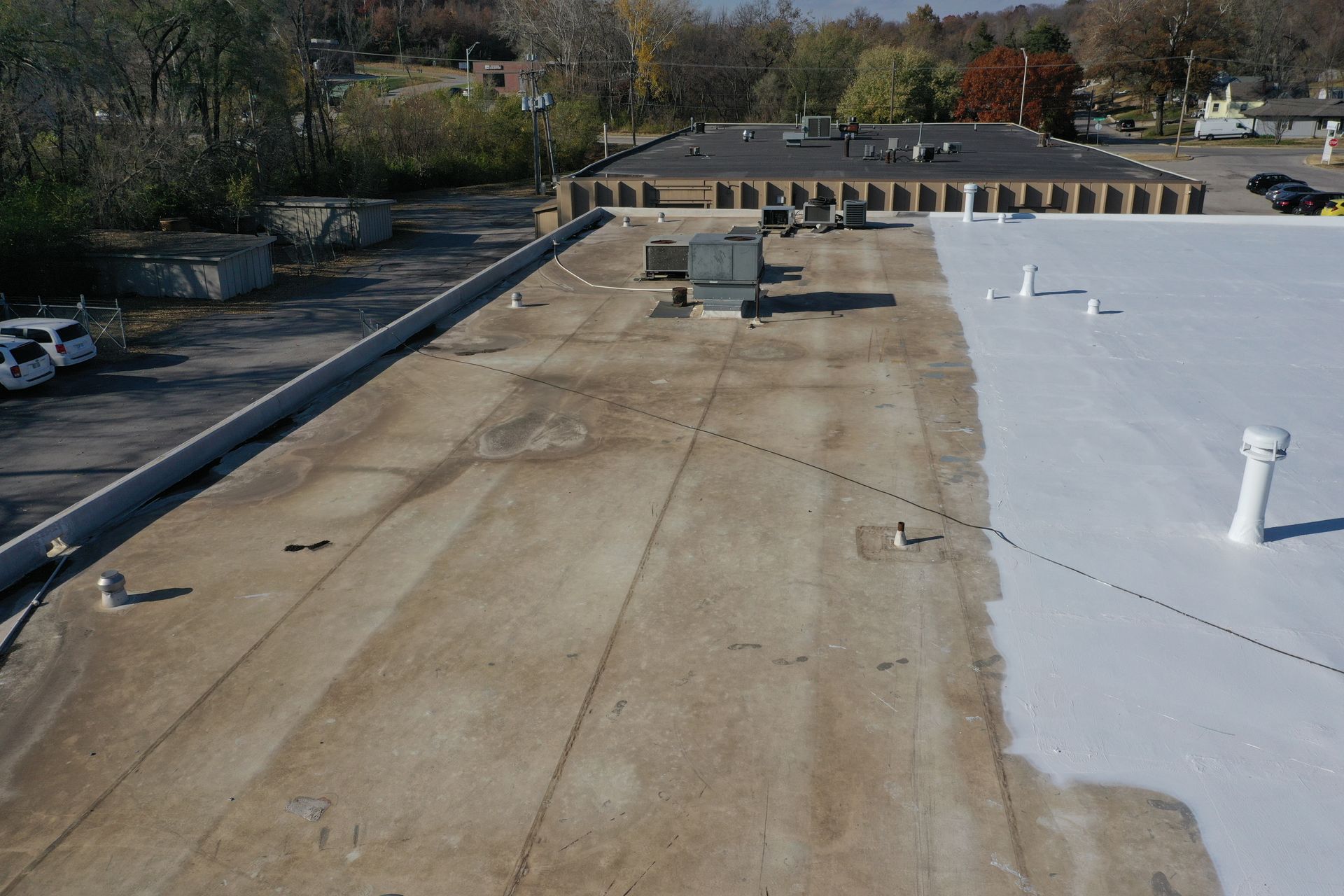 The roof of a building has been painted white