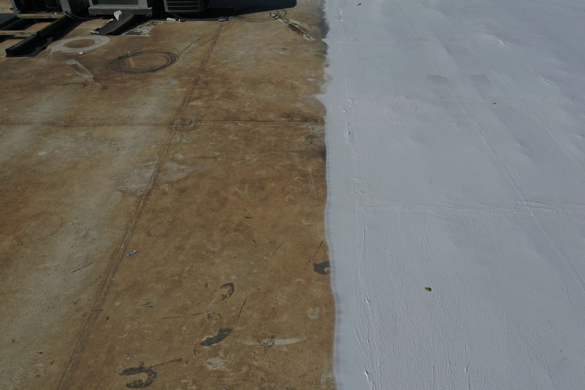 A close up of a concrete surface with a white coating on it.