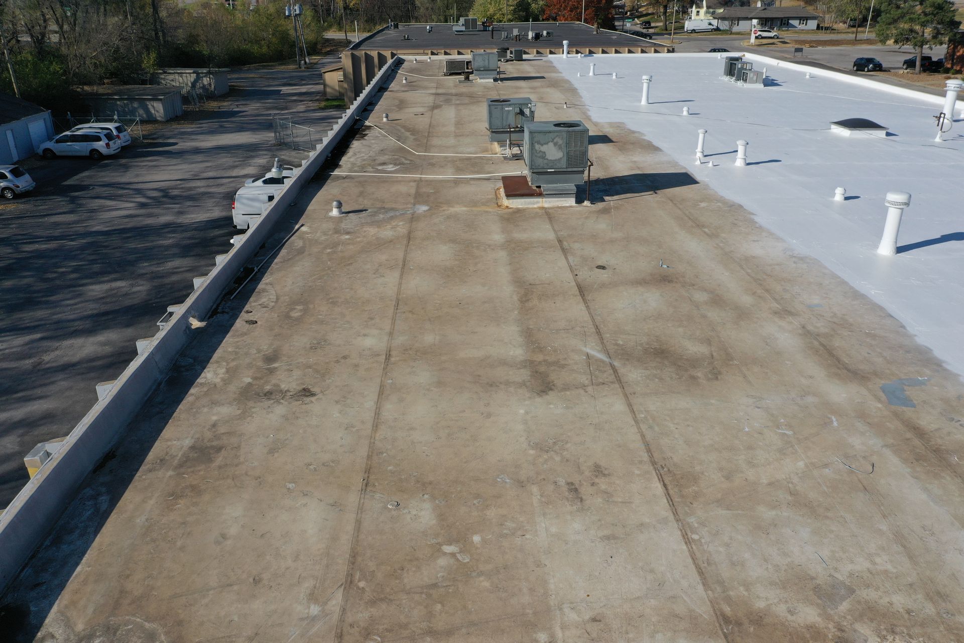 A roof with a lot of air conditioners on it