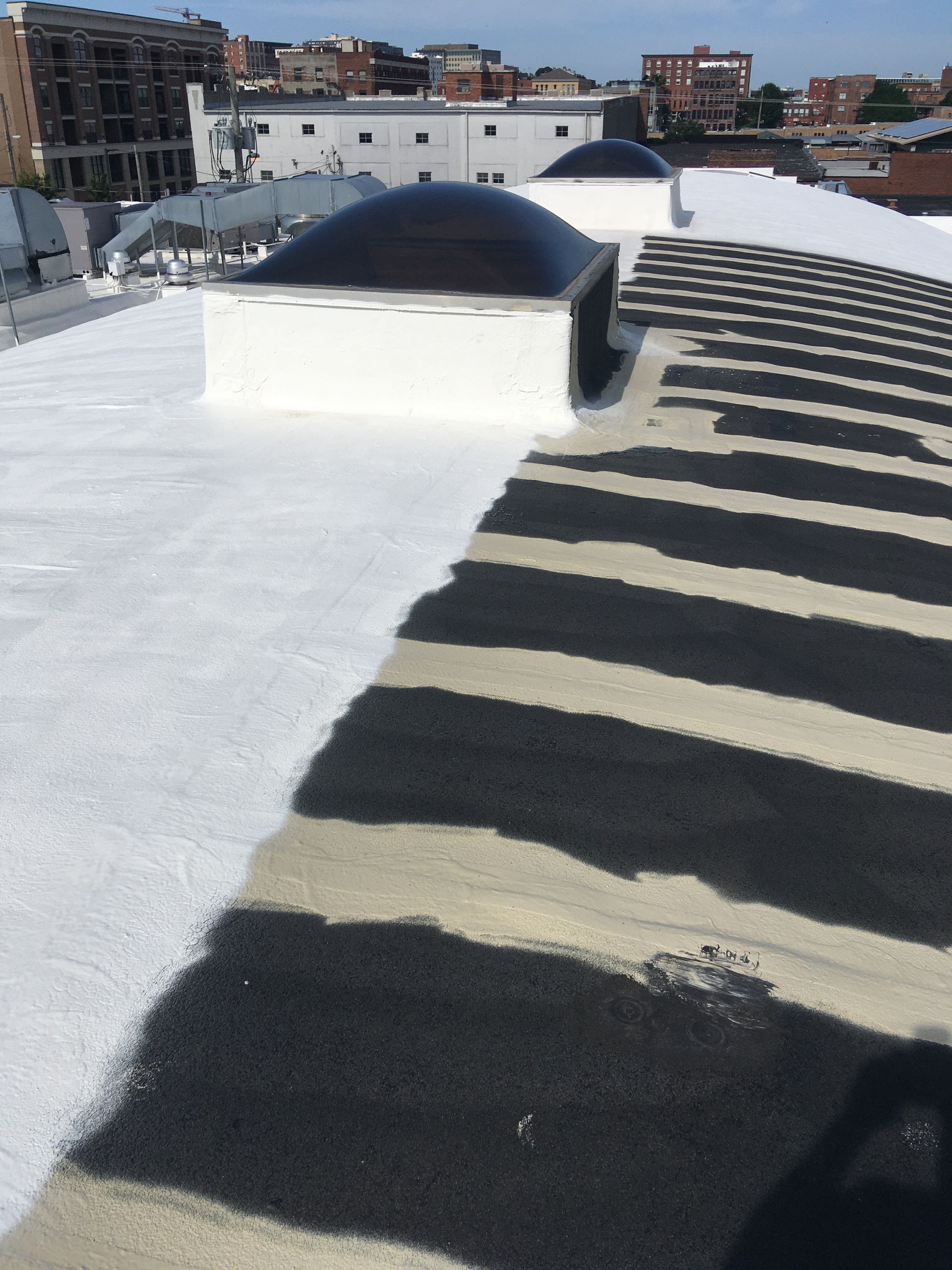 A black and white striped roof with a dome on top