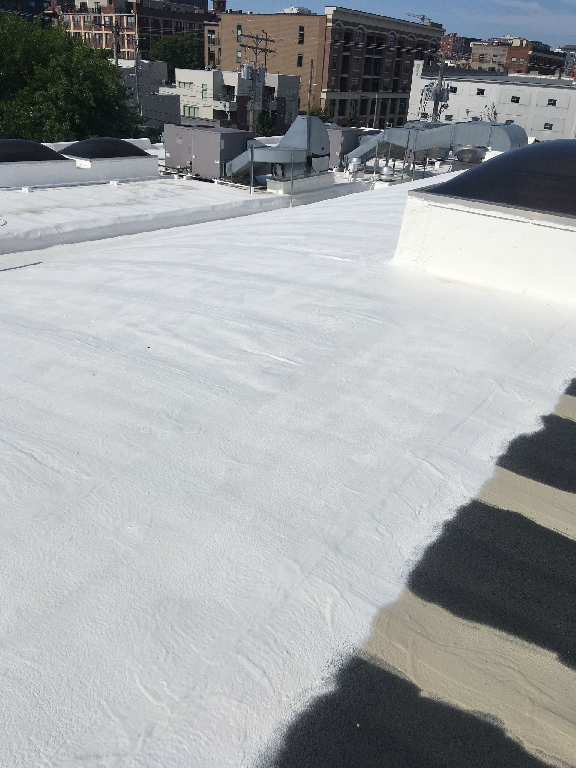 The roof of a building has been painted white