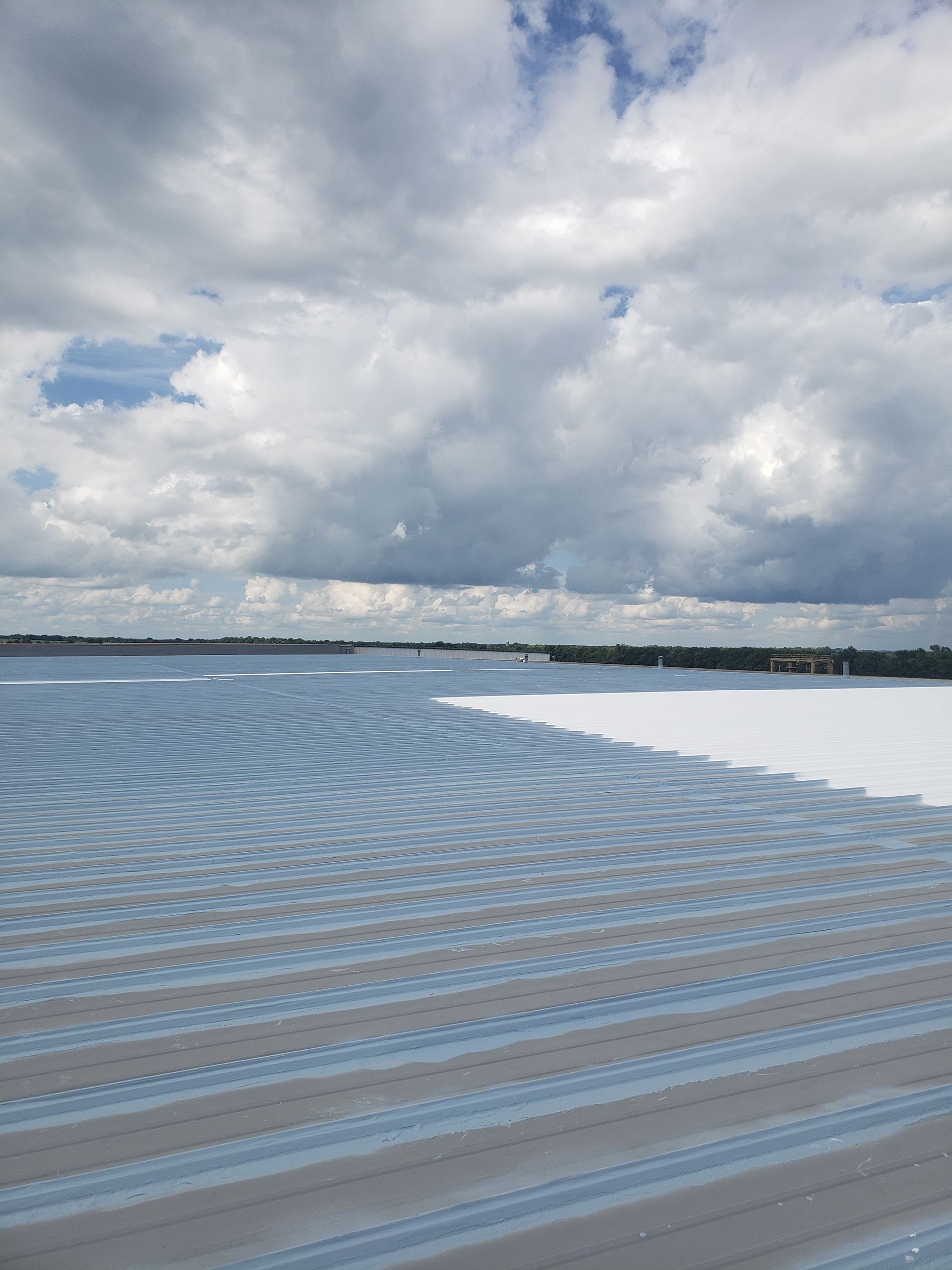 A large body of water with a cloudy sky in the background