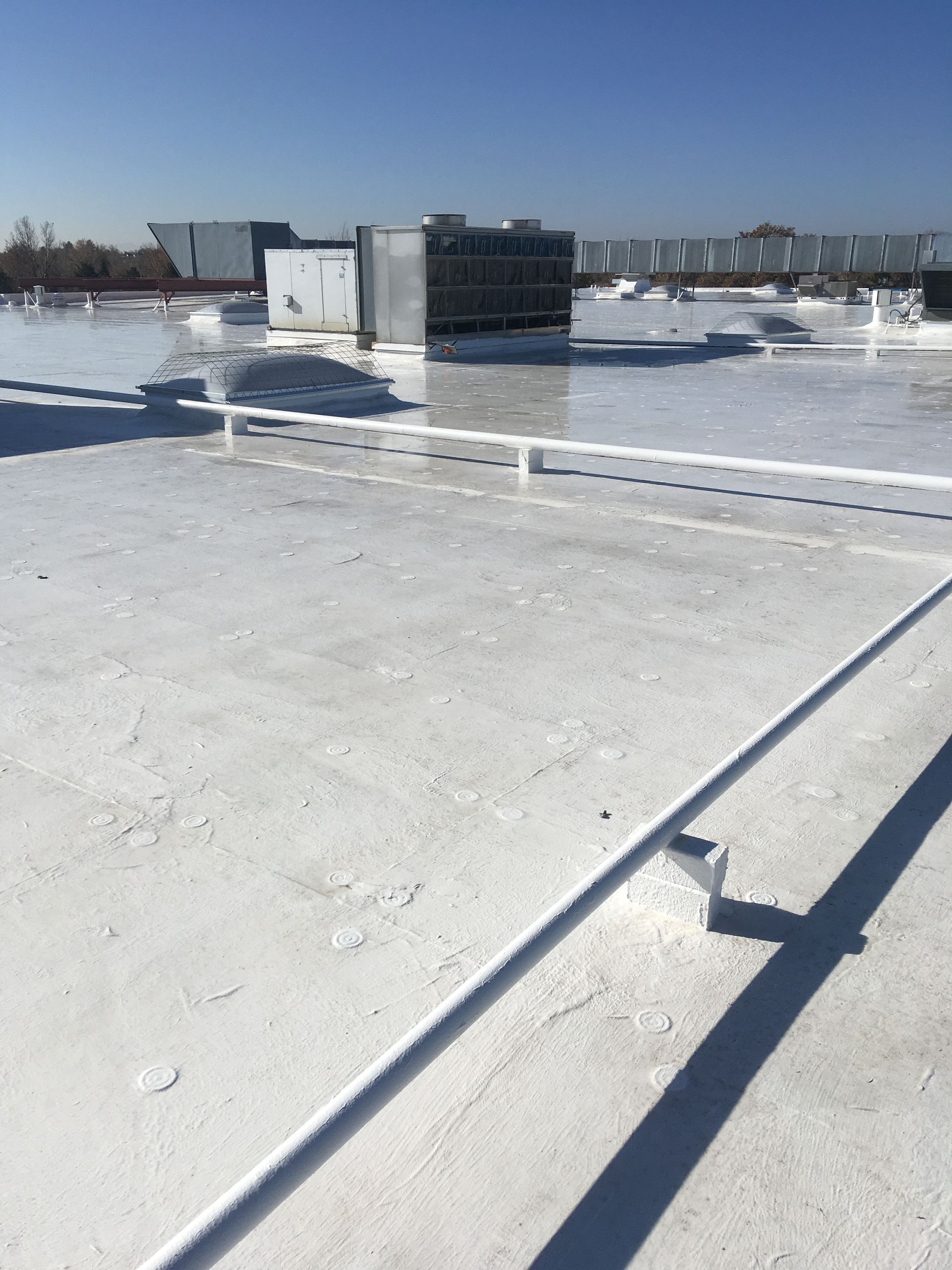 A white roof with a blue sky in the background