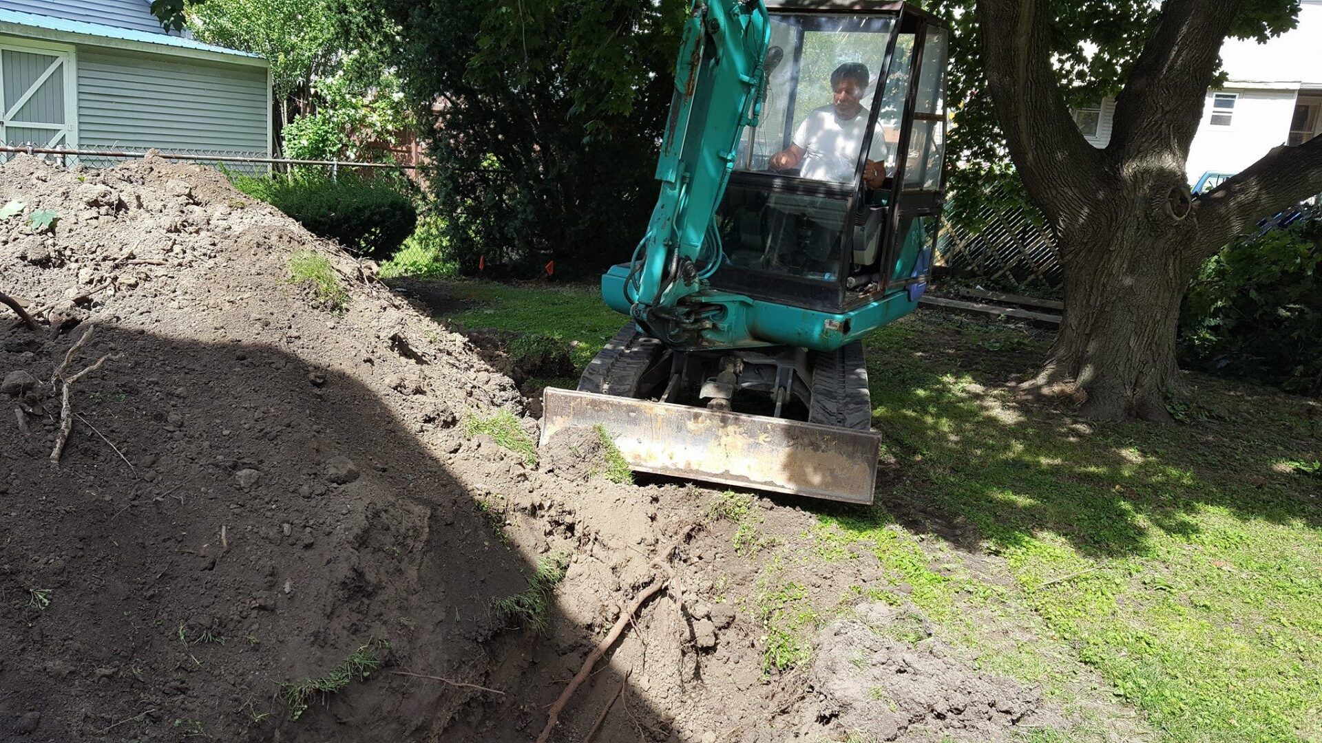 Man Using Excavator — Port Huron, MI —  Modern Sewer & Drain Cleaning