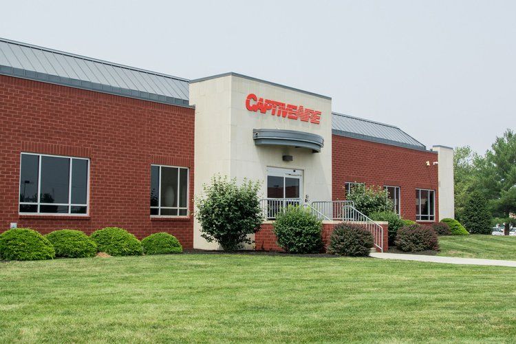 A large brick building with the word captivate on it