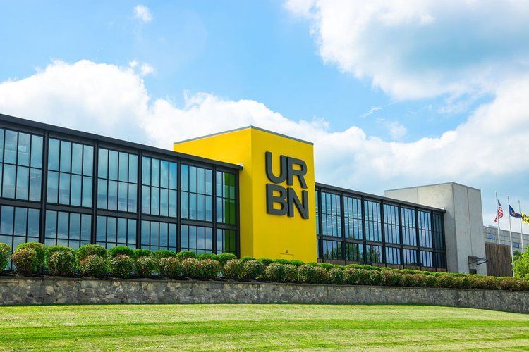 A large yellow building with the word urban on it