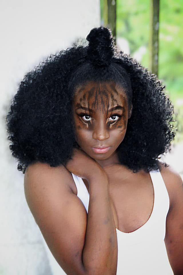 Image of a woman with a tiger make up