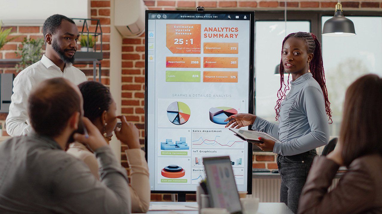 Image of a woman discussing about the business analytics summary