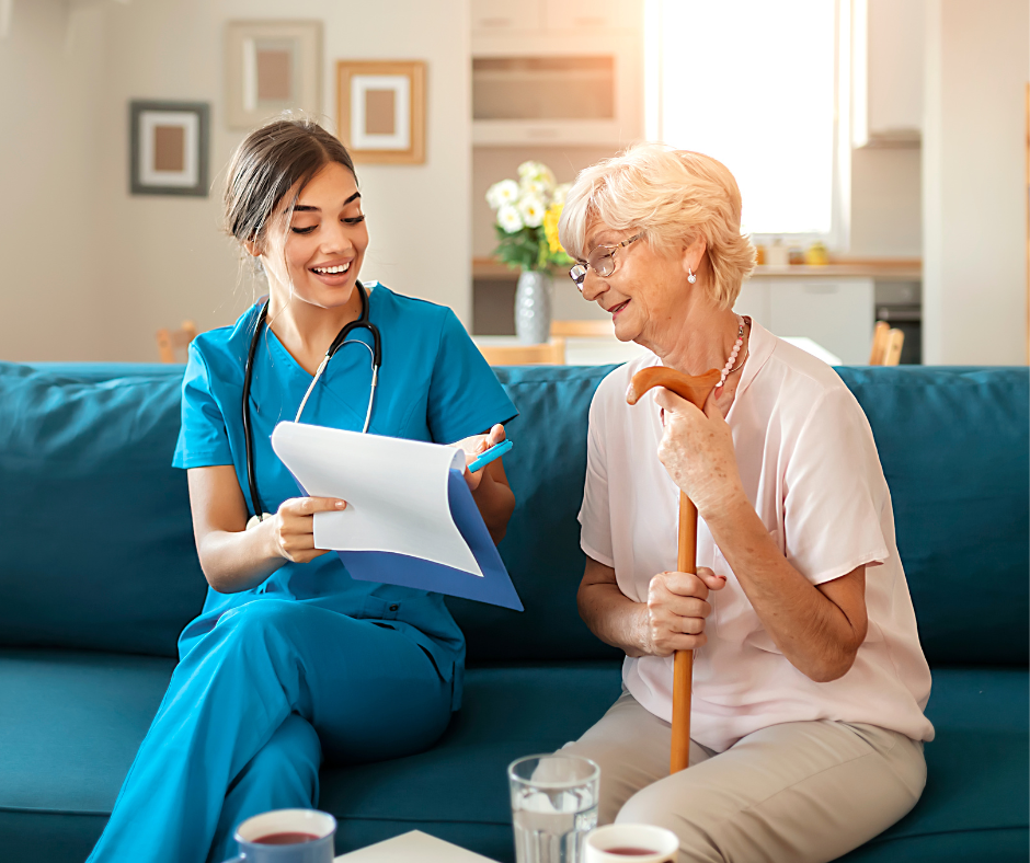 Picture of nurse sitting with a clipboard next to a home care patient