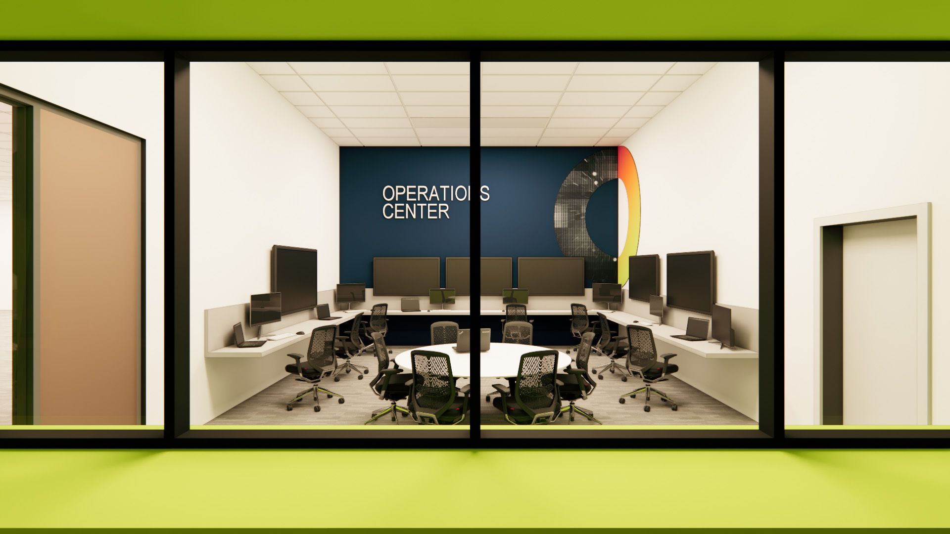A modern Operations Center office with a white desk layout, rolling chairs, and a blue wall with a logo, viewed through glass.