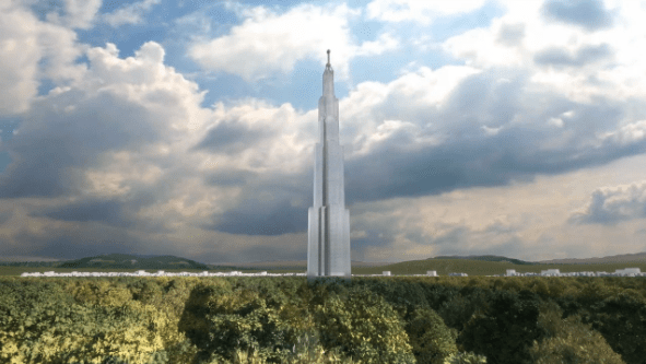 A tall, sleek, multi-tiered white skyscraper rises prominently above a dense green forest under a cloudy sky.