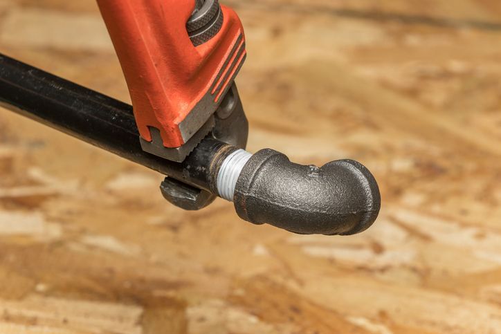 Gas pipe and plumber's wrench in Burlington, MA