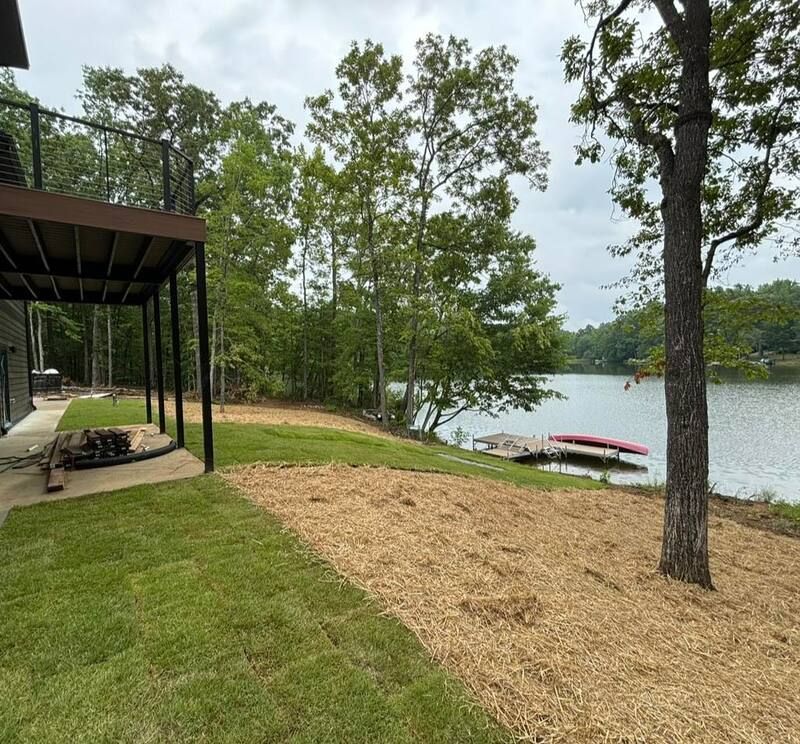 A house with a deck overlooking a lake