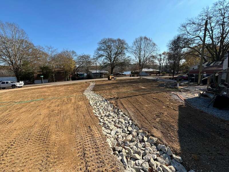 There is a lot of dirt and rocks on the side of the road.