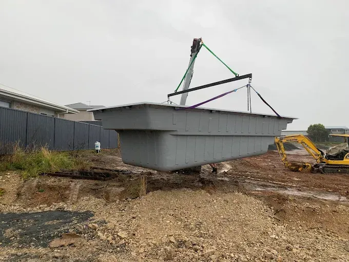 A Large Machine Lowering a New Pool Into The Ground — Solitary Island Pools In Coffs Harbour, NSW
