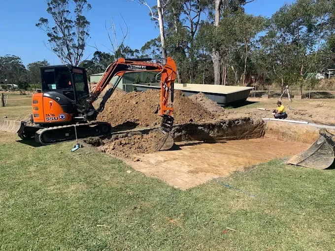An Excavator Digging Out a Pool — Solitary Island Pools In Coffs Harbour, NSW