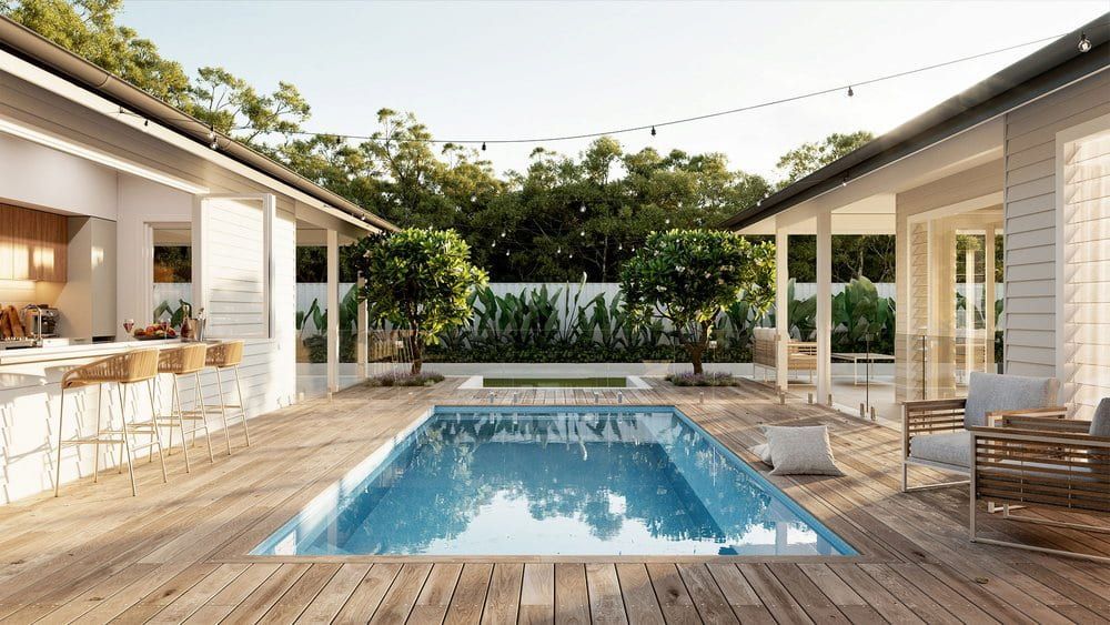 There Is A Large Swimming Pool In The Backyard Of A House — Solitary Island Pools in Coffs Harbour, NSW