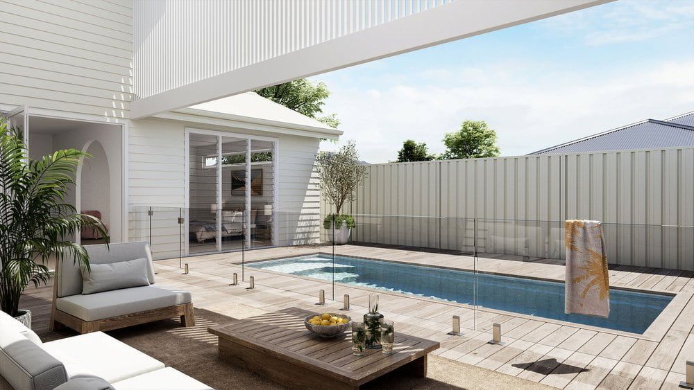 A Large Swimming Pool In The Backyard Of A House — Solitary Island Pools in Coffs Harbour, NSW