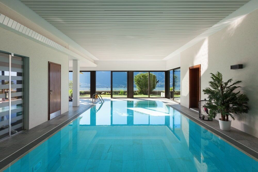 A Large Indoor Swimming Pool With A Lot Of Windows — Solitary Island Pools in Coffs Harbour, NSW