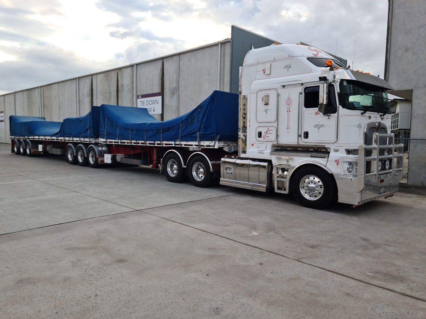 A Large Flat bed loaded and ready to transport— Smillie Transport Pty Ltd in Two Mile, QLD