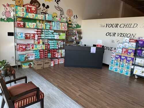 A room filled with lots of diapers and a desk.