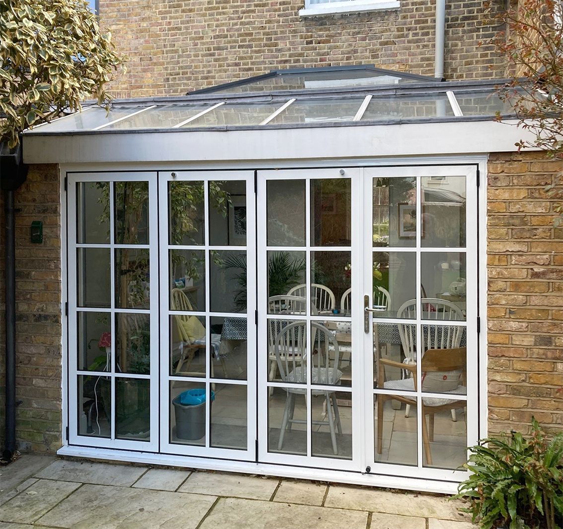 Timber French Doors converted to Modern Authentic Bi-folding Doors in London Property
