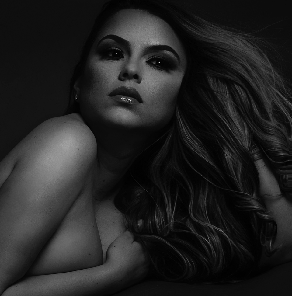 A black and white photo of a woman with long hair