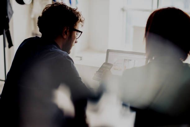 Two people contemplating a recruitment hiring strategies