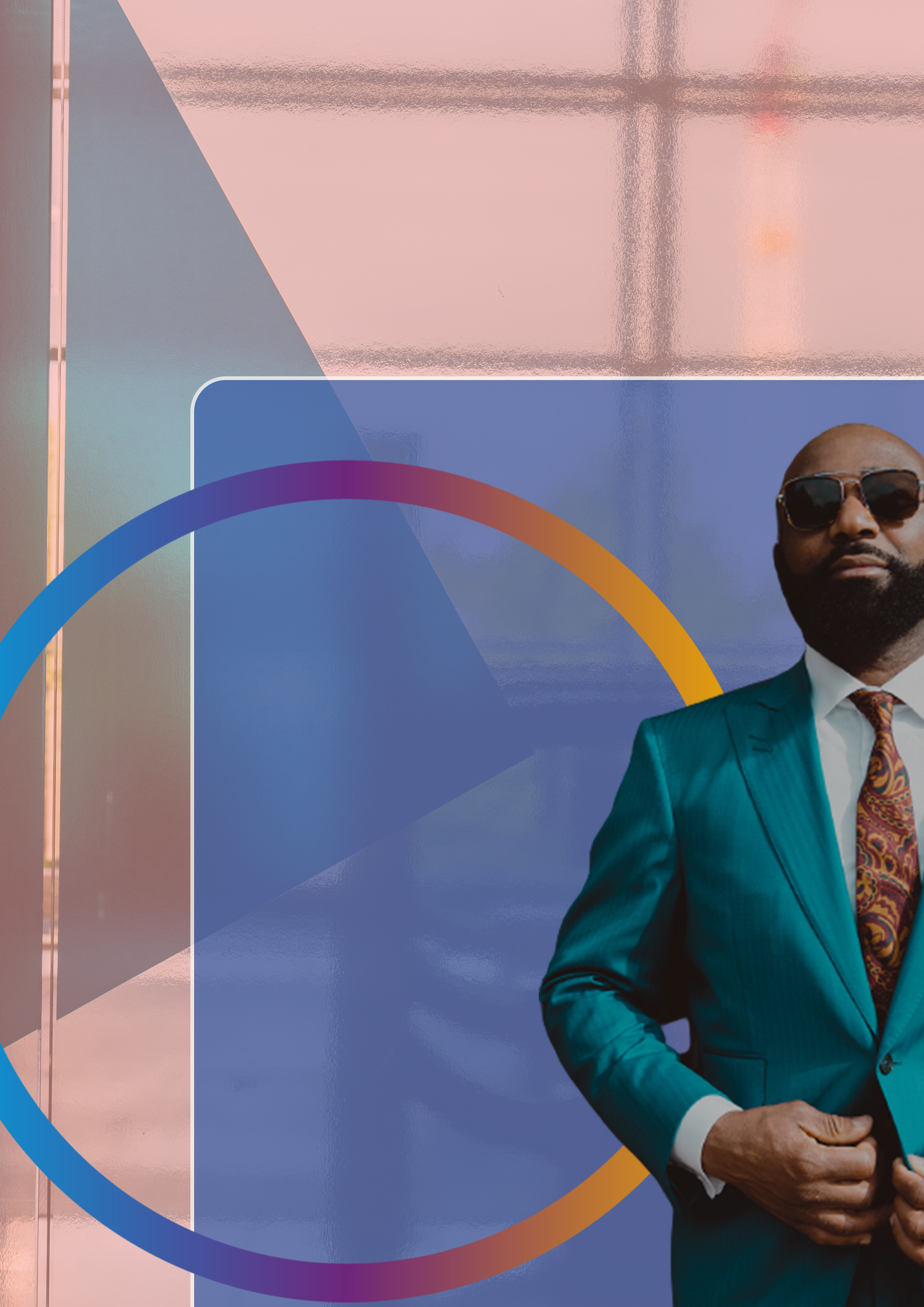 Man in teal suit and sunglasses, standing in front of a window, with a blue and orange graphic overlay.