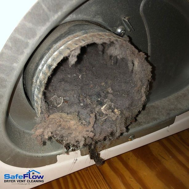 A close up of a dirty vent on a washing machine.