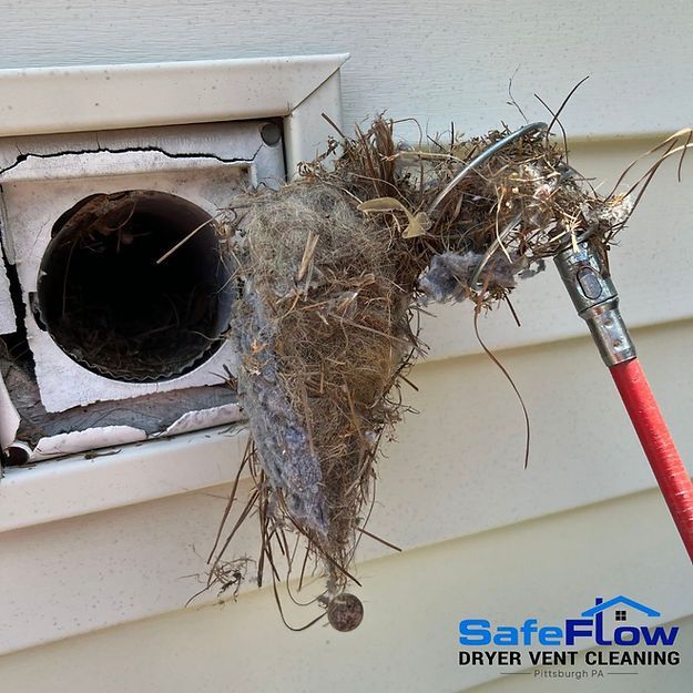A dryer vent is being cleaned by safeflow dryer vent cleaning