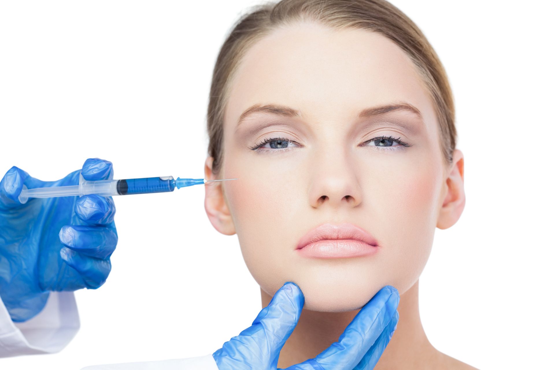 a woman is getting a botox injection in her face .