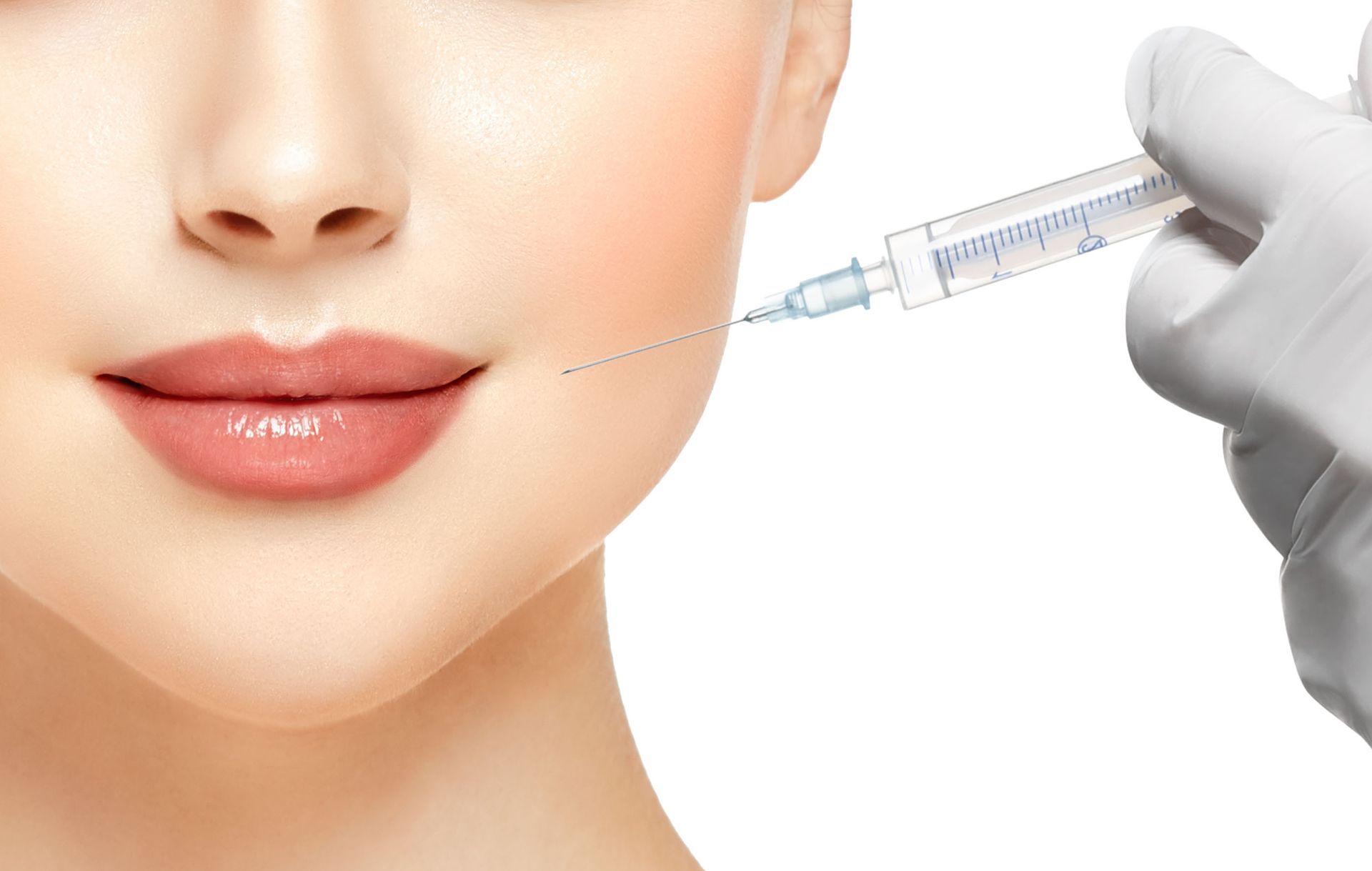 a woman is getting a botox injection in her mouth .