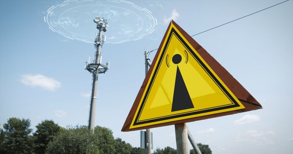 EMF Warning Sign And A 5G Tower Causing Radiation — EMF Testing in Nowra, NSW
