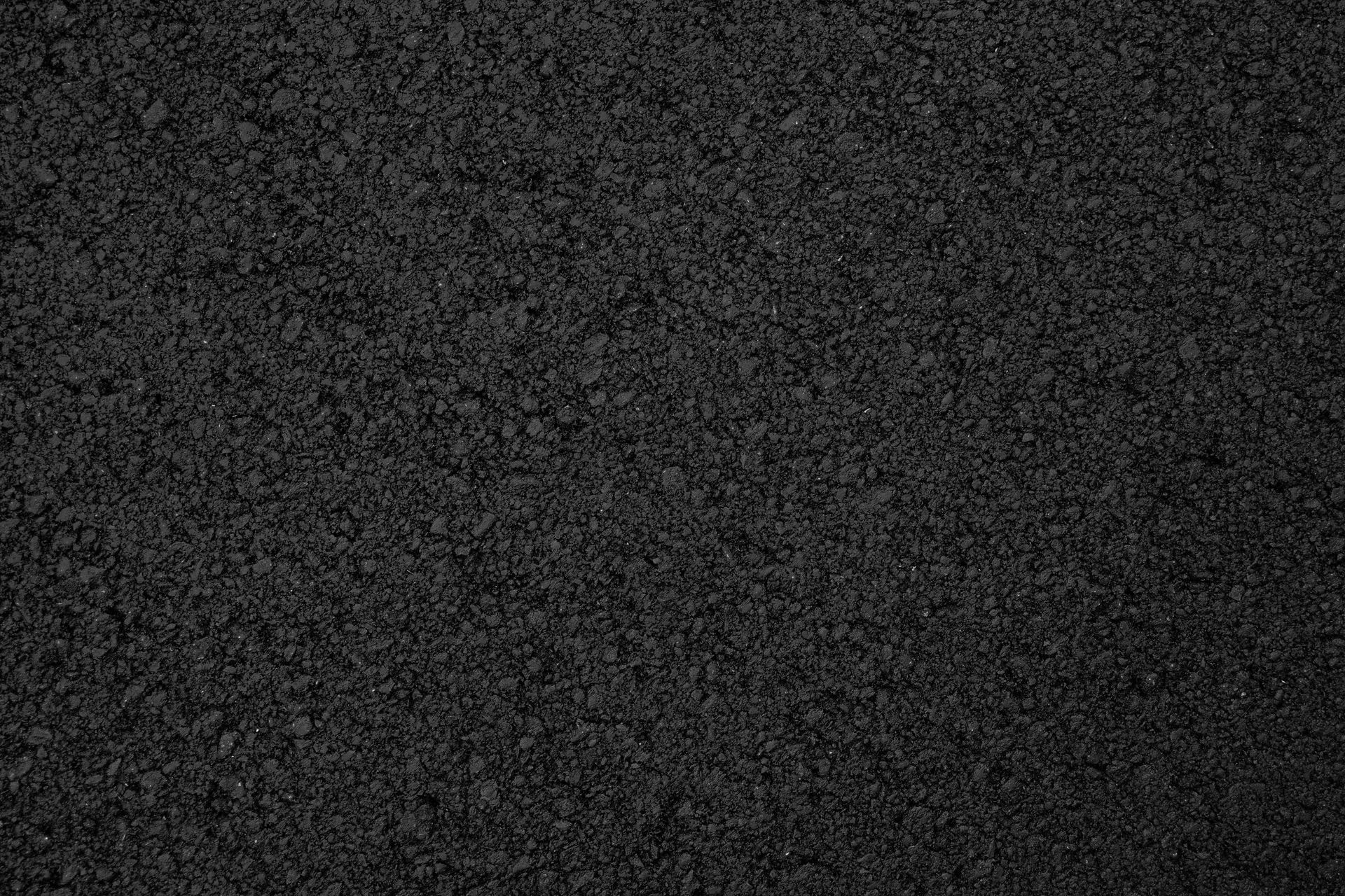 Dark gray asphalt surface.