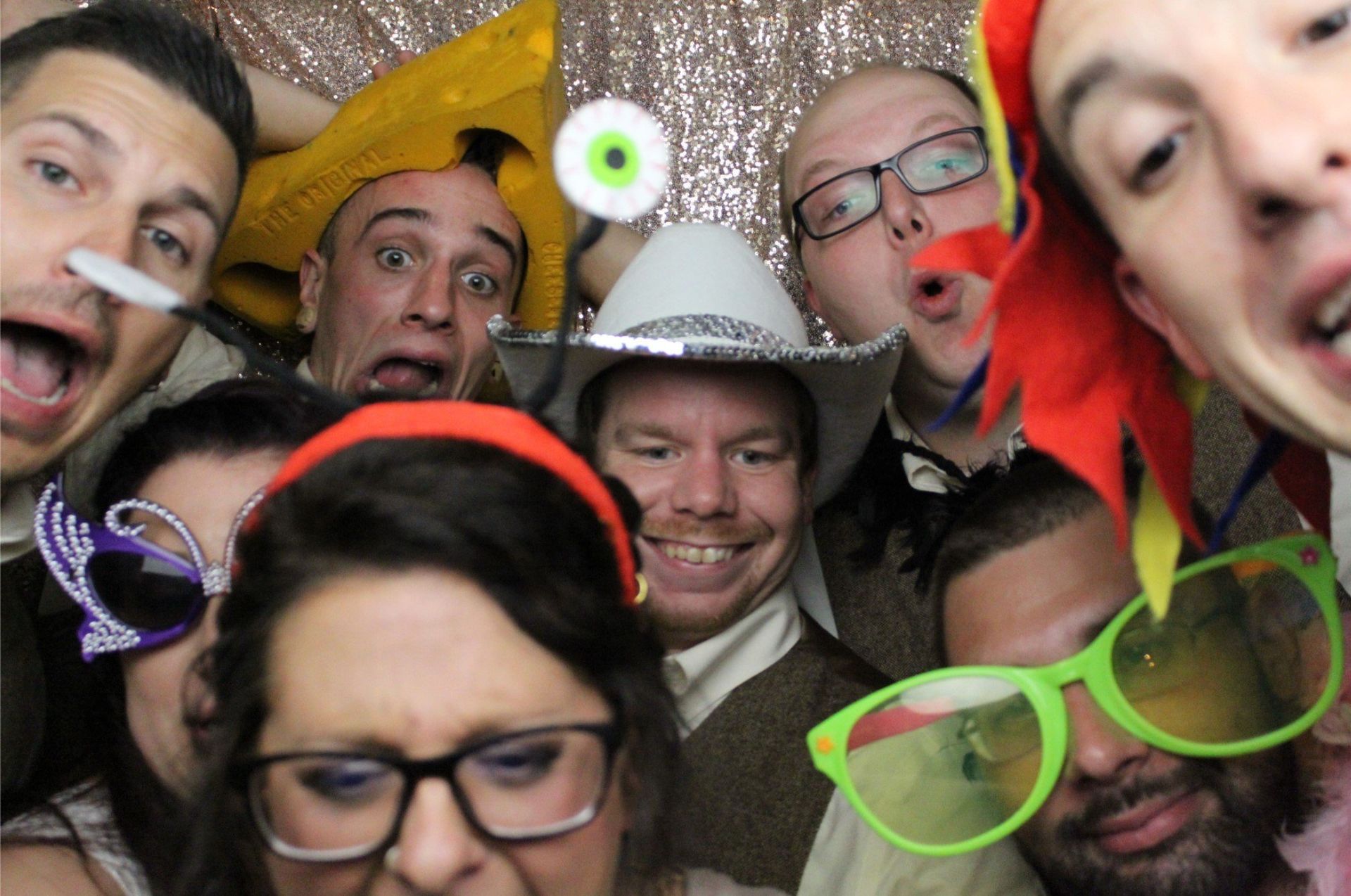 Oshkosh photo booth rentals with fun props and a gold backdrop, sound sensations entertainment photo booth rentals
