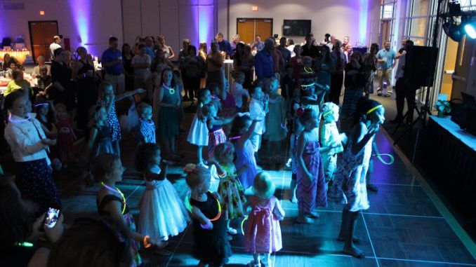 kids birthday party themes, packed dance floor, kids on the dance floor