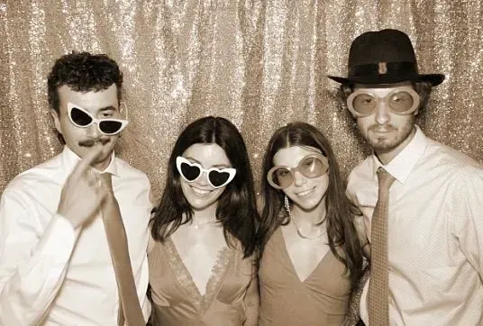 Oshkosh Photo Booth Rental, Posing for a pic with the Rose Gold backdrop