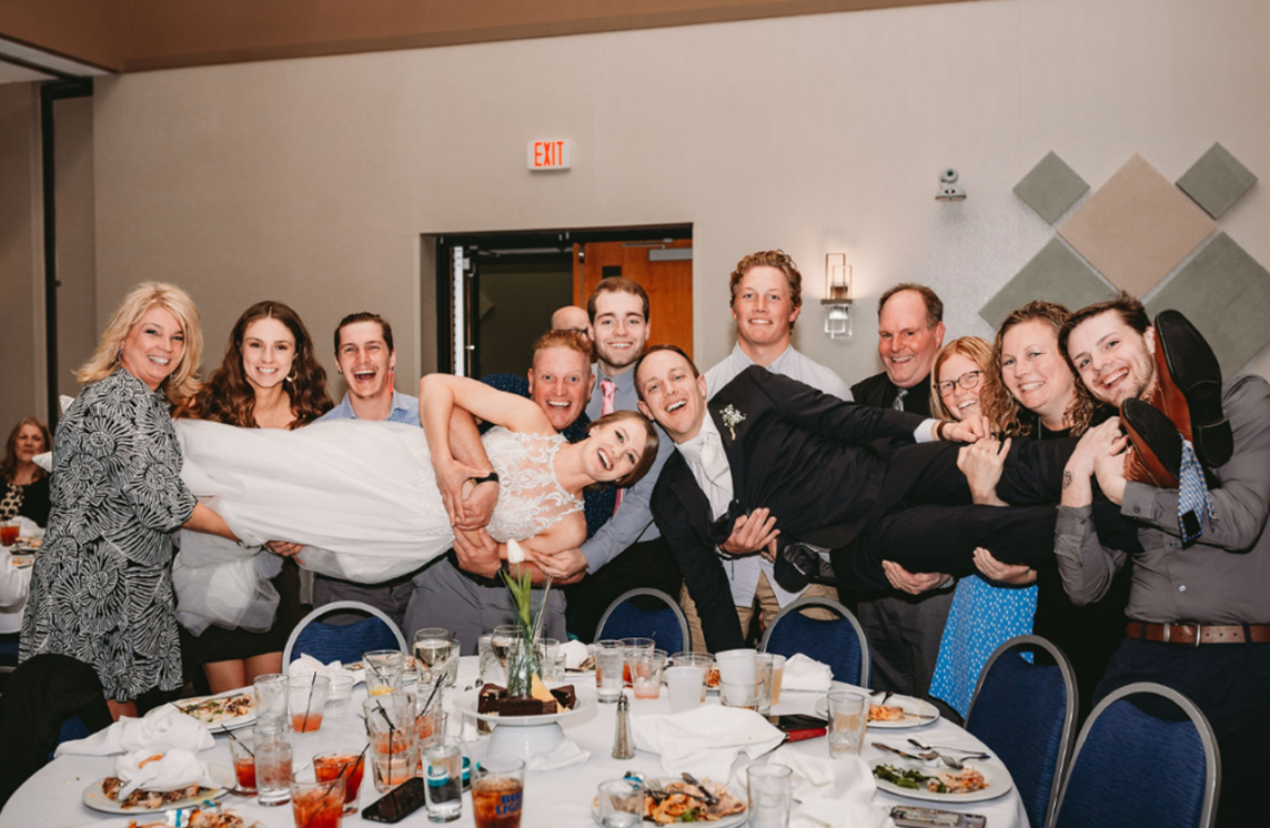 Wisconsin wedding couple doing Table Photos as part of their wedding fun at their wedding celebration