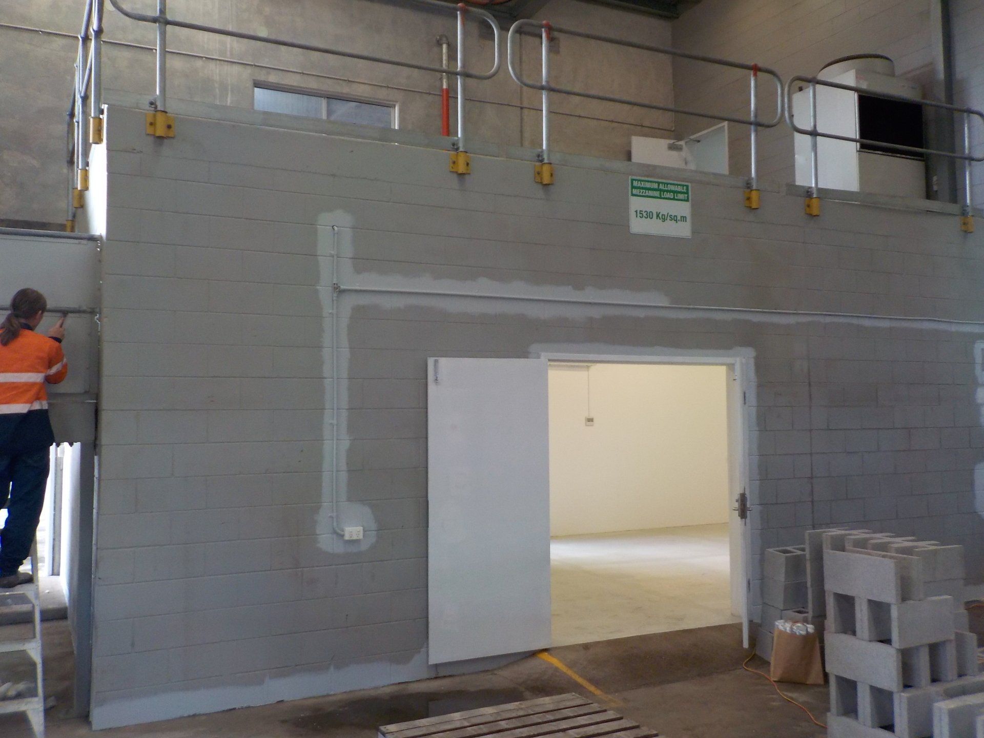 halfway through painting inside of warehouse building