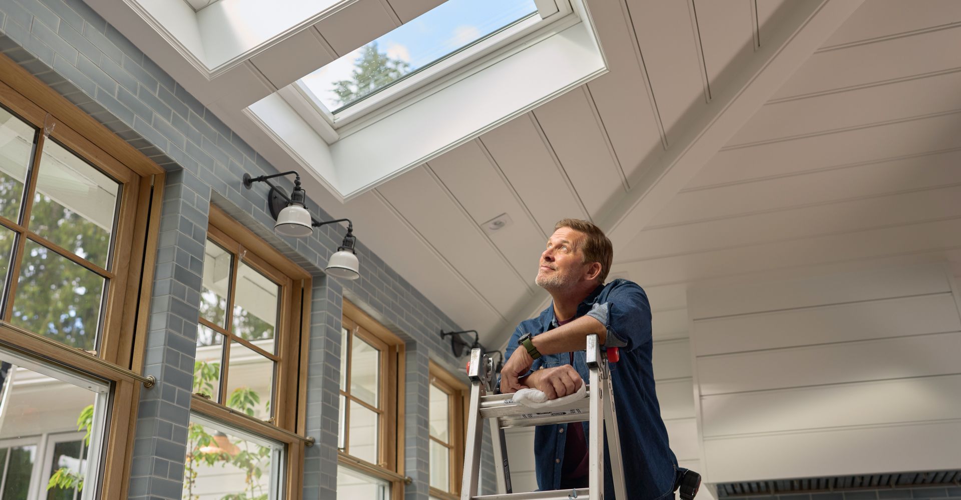 There is a skylight on the roof of a house.