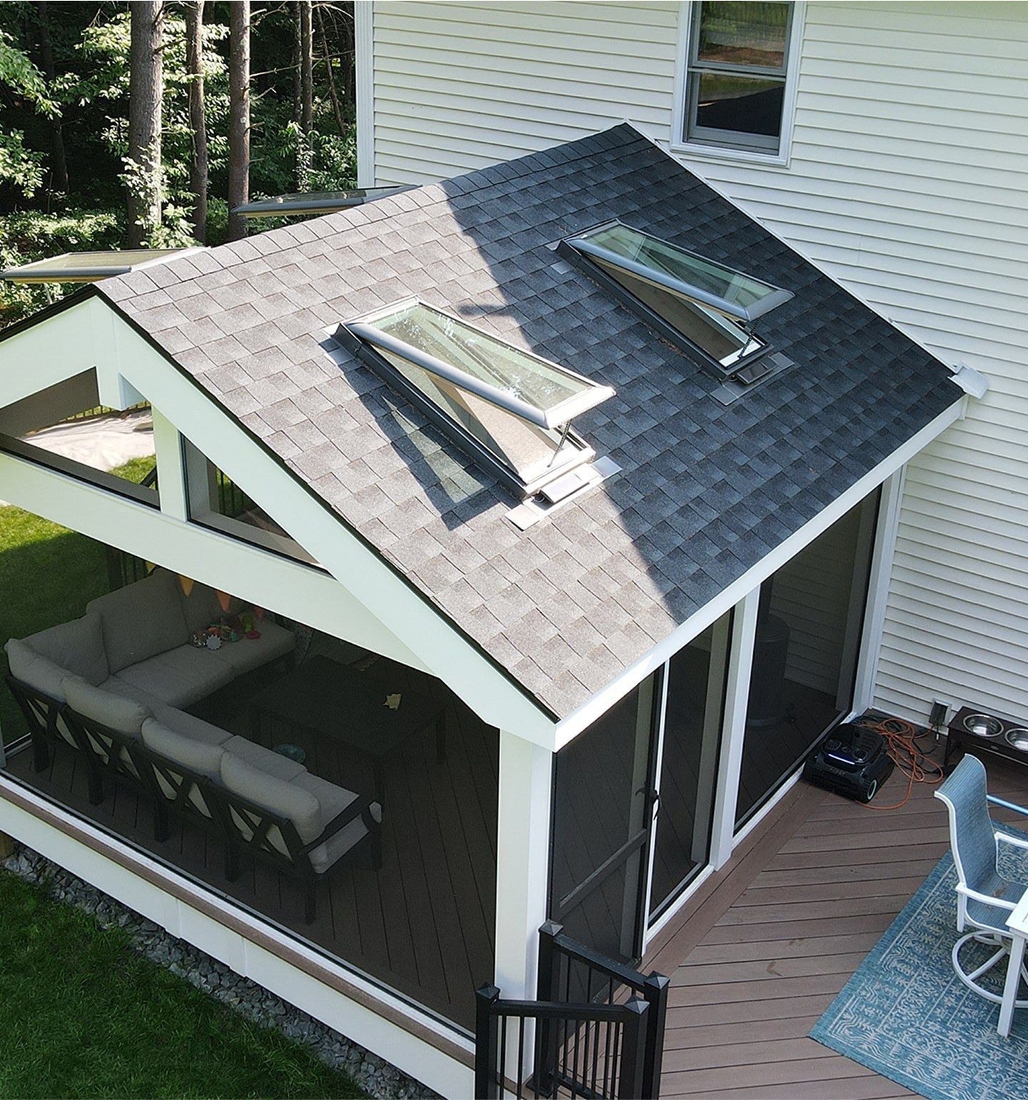 A rope is hanging from the side of a building.