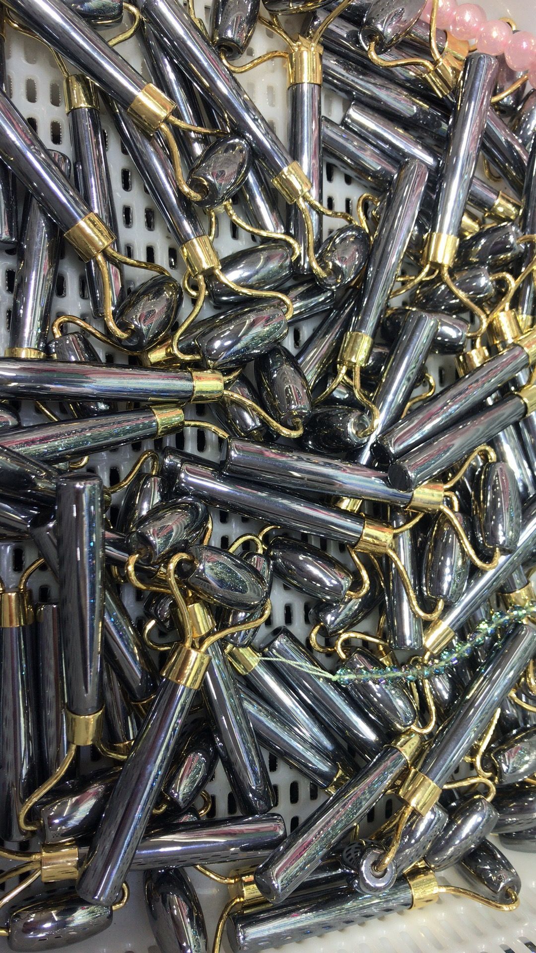 A face roller is sitting on top of a pile of rocks.