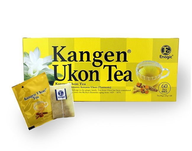 A box of kangen ukon tea next to a cup of tea