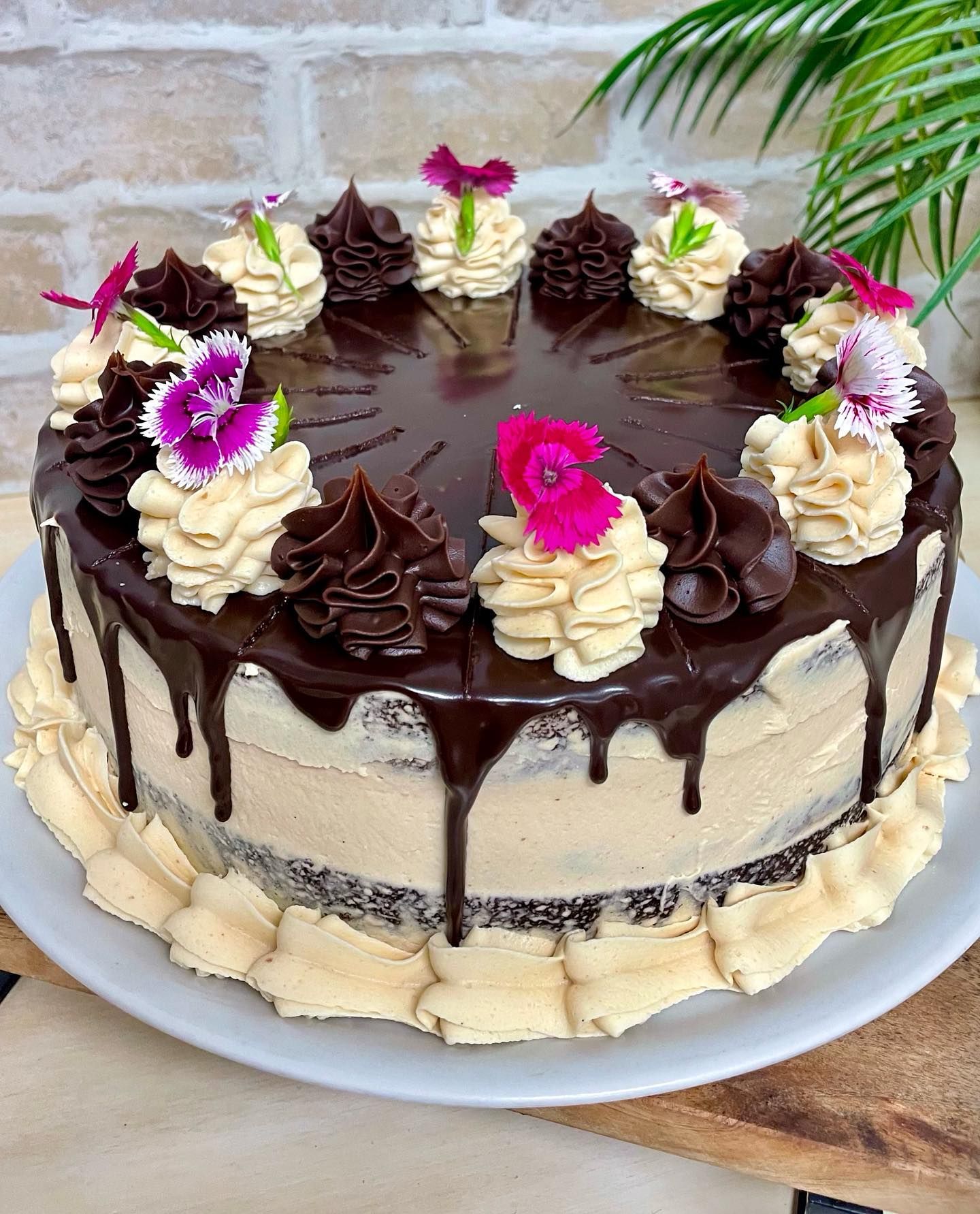 A Chocolate Cake With Chocolate Ganache, Tan Frosting, Decorative Flowers — Flour in Yeppoon, QLD