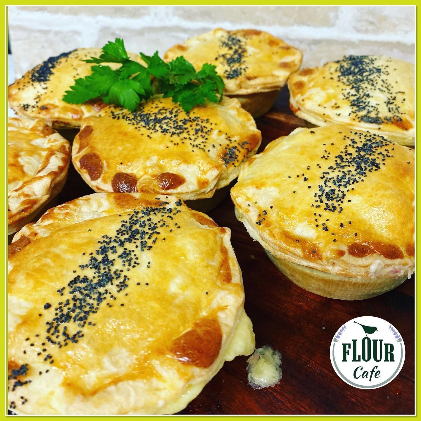 A Savory Pies With Golden Crusts, Some Sprinkled With Poppy Seeds — Flour in Yeppoon, QLD